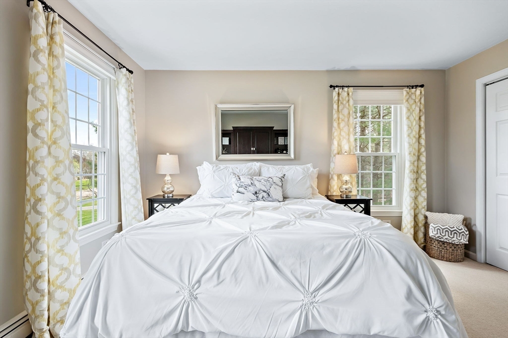 23 Northern Spy Road Franklin, MA 02038 - Photo 22 of 41 a bedroom with a bed and a flat screen tv