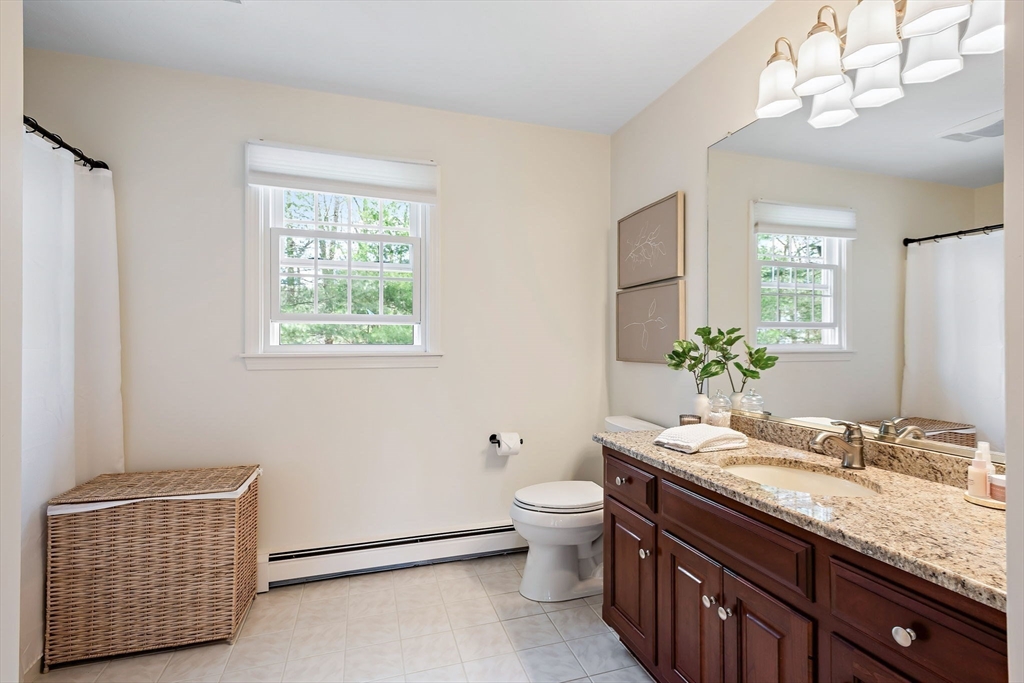 23 Northern Spy Road Franklin, MA 02038 - Photo 24 of 41 a bathroom with a granite countertop sink and a mirror