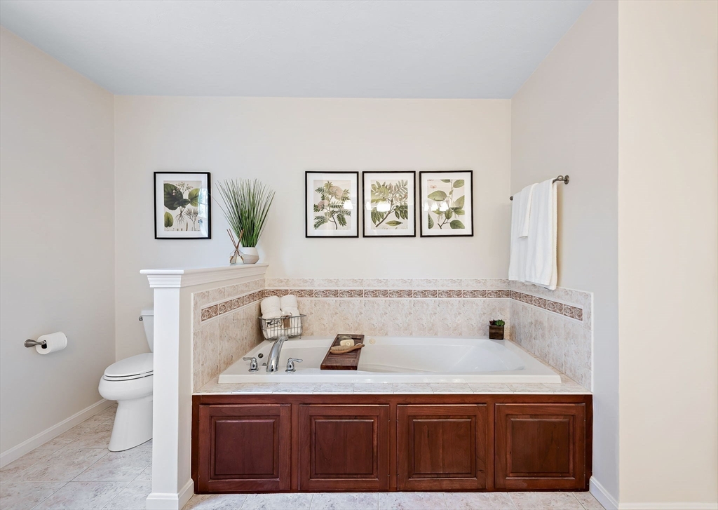 23 Northern Spy Road Franklin, MA 02038 - Photo 32 of 41 a bathroom with a sink a toilet and a window