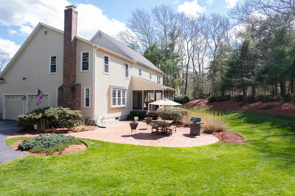 23 Northern Spy Road Franklin, MA 02038 - Photo 36 of 41 a view of a house with backyard sitting area and garden