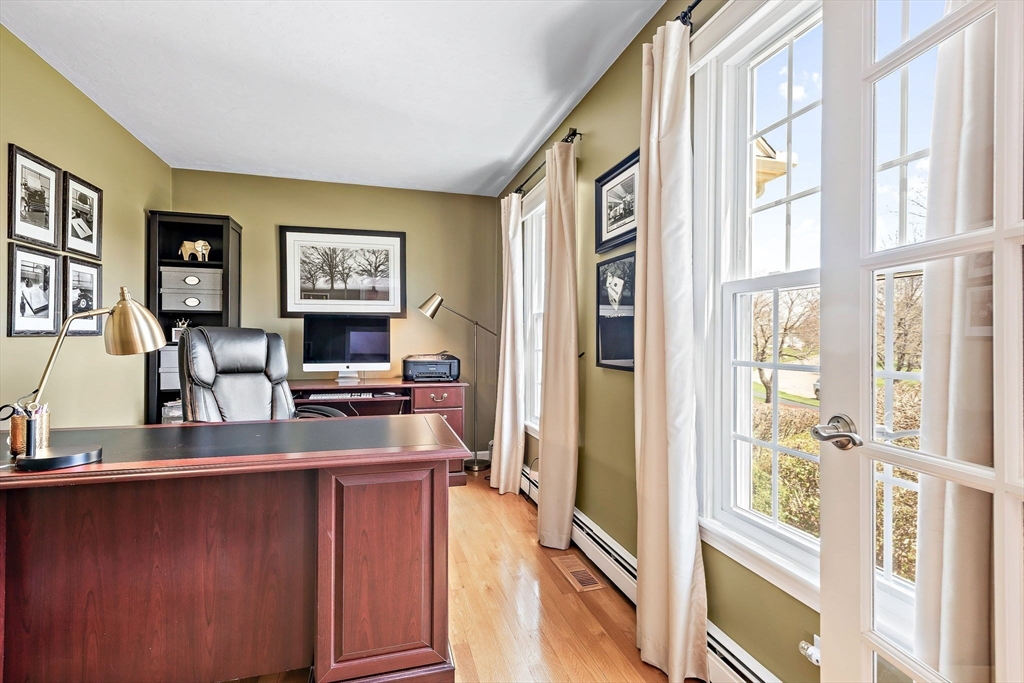 23 Northern Spy Road Franklin, MA 02038 - Photo 5 of 41 a living room with stainless steel appliances furniture and a flat screen tv