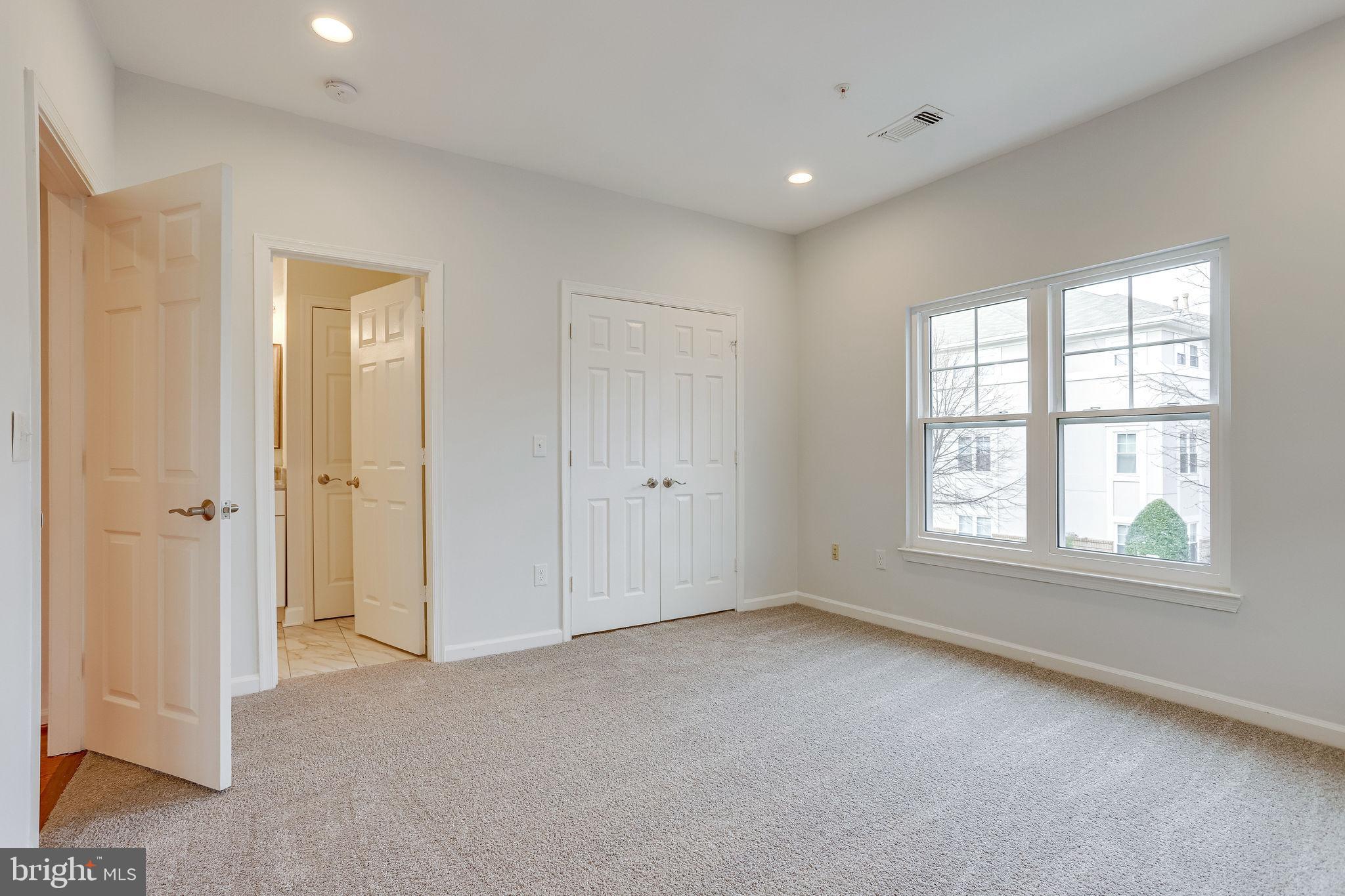 12009 Taliesin Place, Unit 26 Reston, VA 20190 - Photo 9 of 20 Master Bedroom with walk-in closet
