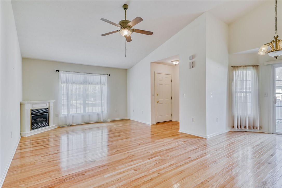 200 Rayfield Circle Webster, NY 14580 - Photo 10 of 41 LIVING ROOM W/SOARING CEILING & HARDWOOD FLOORING!