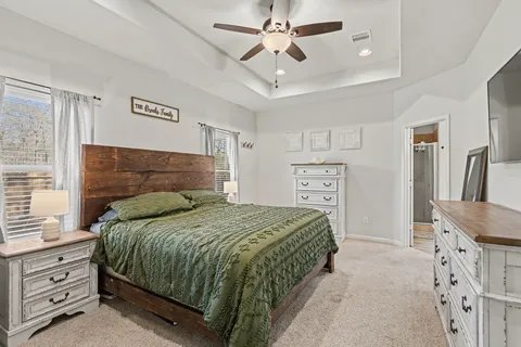 a bedroom with a bed and a dresser