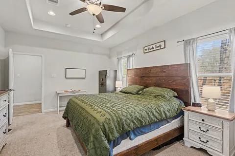 a bedroom with a bed and a dresser