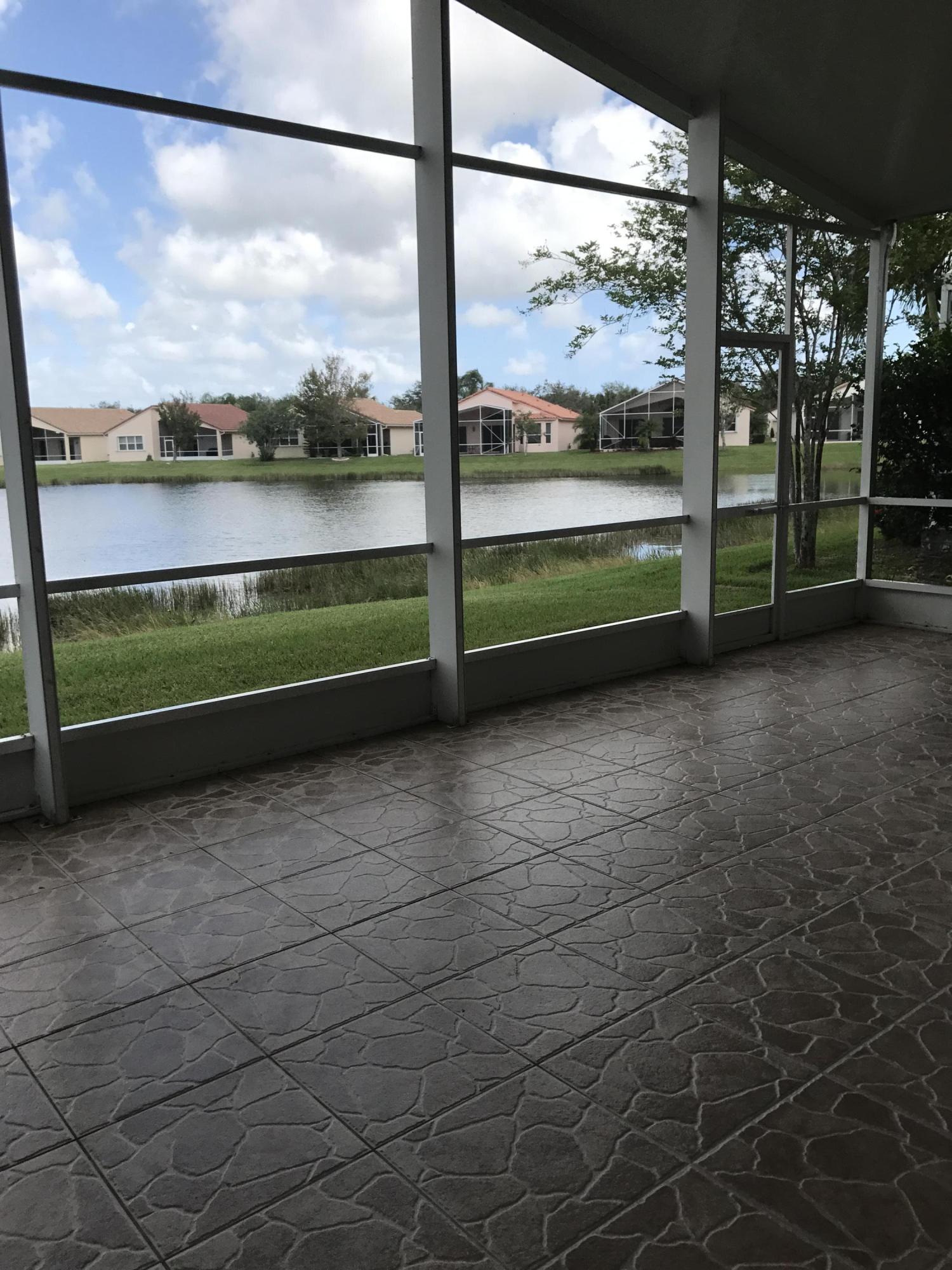 328 Springview Loop Port St. Lucie, FL 34986 - Photo 21 of 25 View of lake from patio
