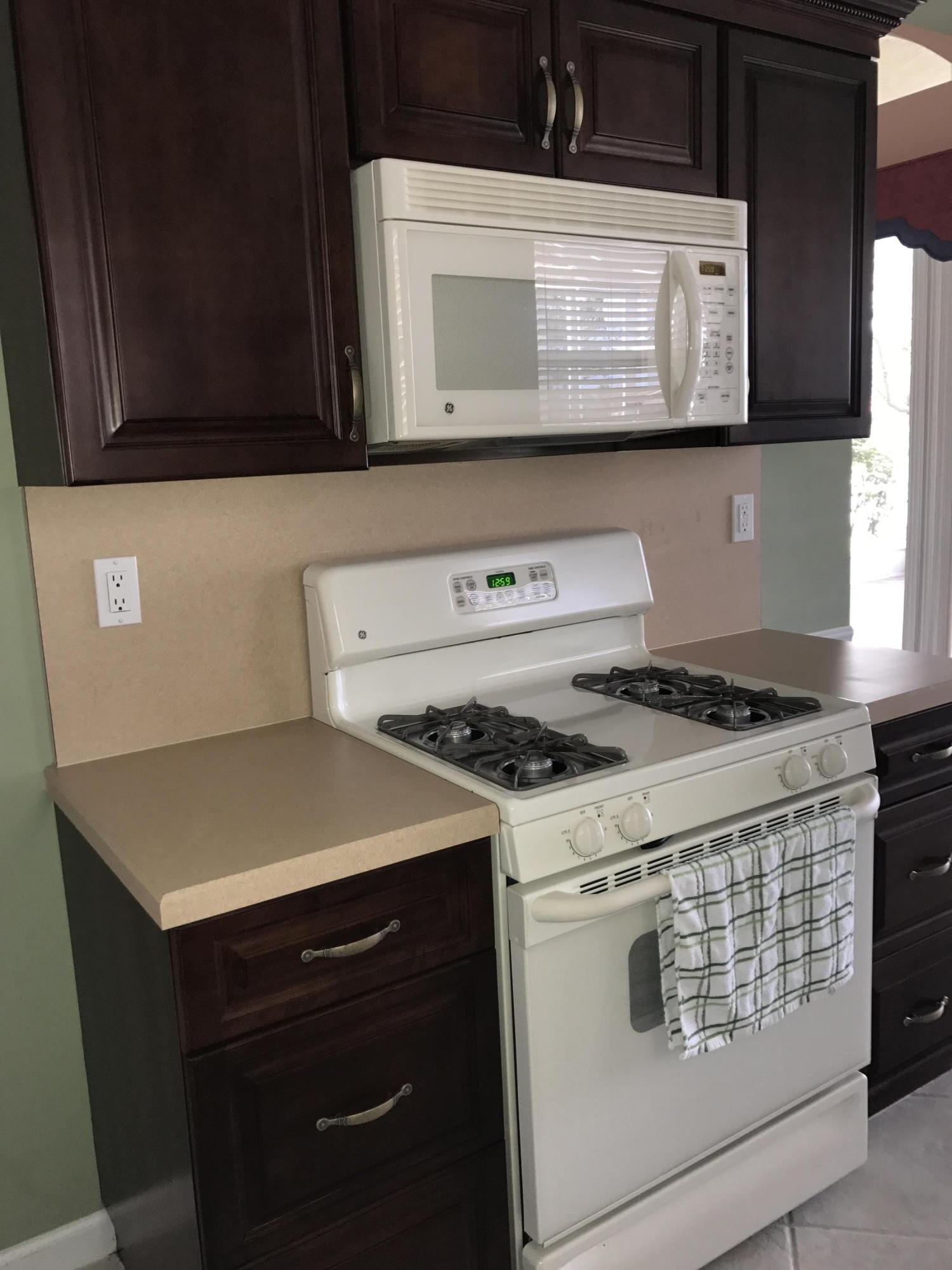 328 Springview Loop Port St. Lucie, FL 34986 - Photo 8 of 25 Gas stove and Microwave