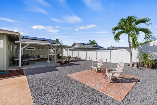 a view of a patio with swimming pool table and chairs