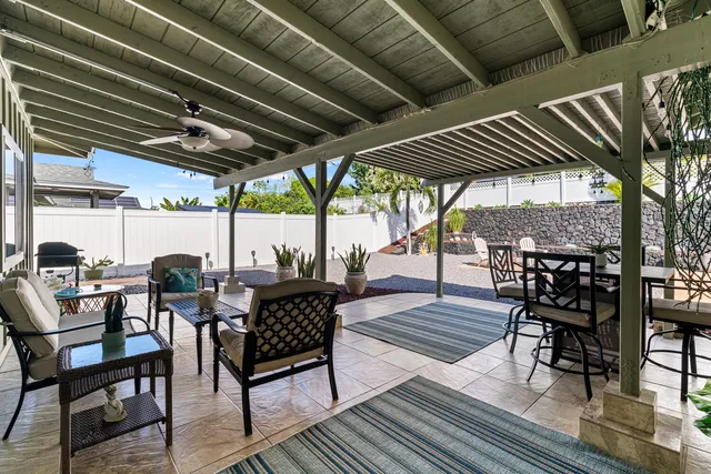 a view of a chairs and table in the patio