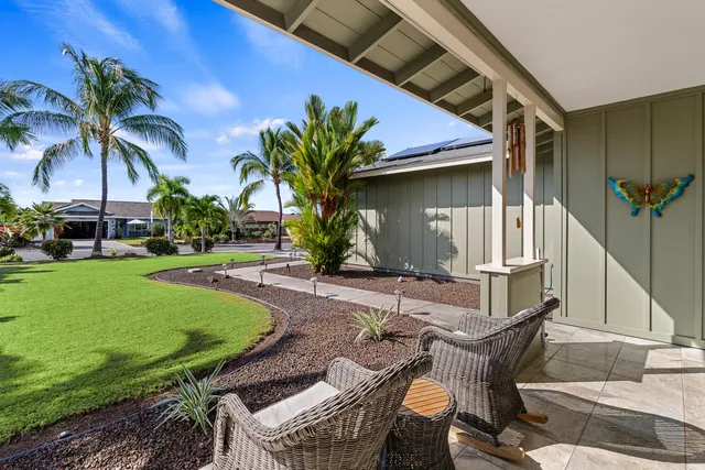 a view of a backyard with a patio and plants