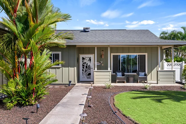 a front view of a house with garden
