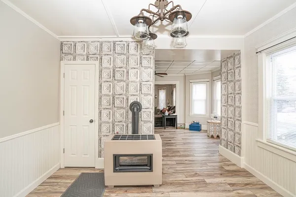 a view of an entryway with wooden floor