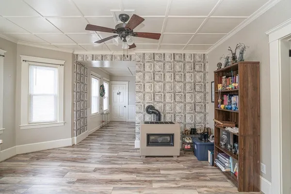 a living room with lots of furniture and a book shelf
