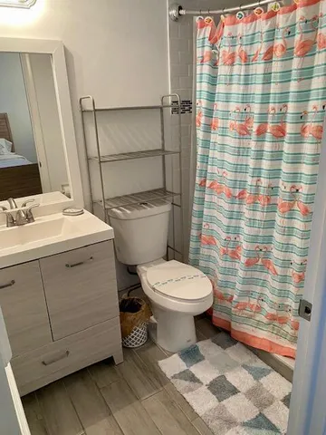 a bathroom with a toilet and a sink