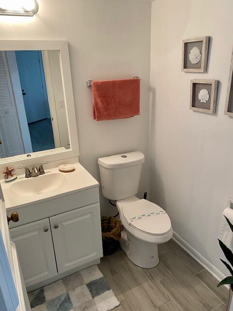1605 Highway 1, Unit V2106 Jupiter, FL 33477 - Photo 15 of 18 a bathroom with a toilet sink and mirror