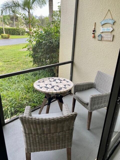1605 Highway 1, Unit V2106 Jupiter, FL 33477 - Photo 18 of 18 a living room with furniture and a floor to ceiling window