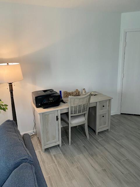 1605 Highway 1, Unit V2106 Jupiter, FL 33477 - Photo 9 of 18 a living room with furniture and a wooden floor