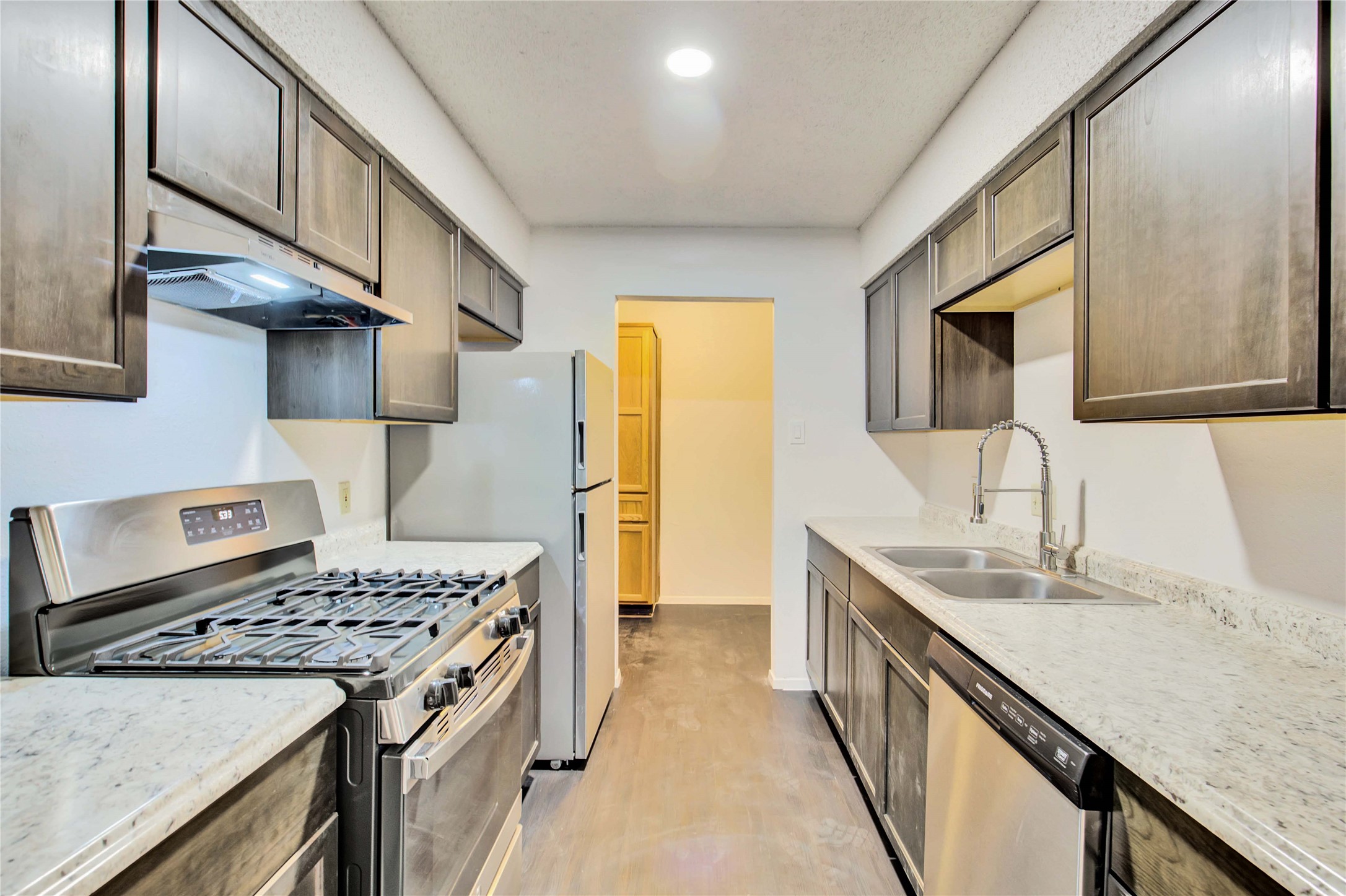 2807 Firecrest Drive Austin, TX 78748 - Photo 15 of 30 a kitchen with a stove and a sink