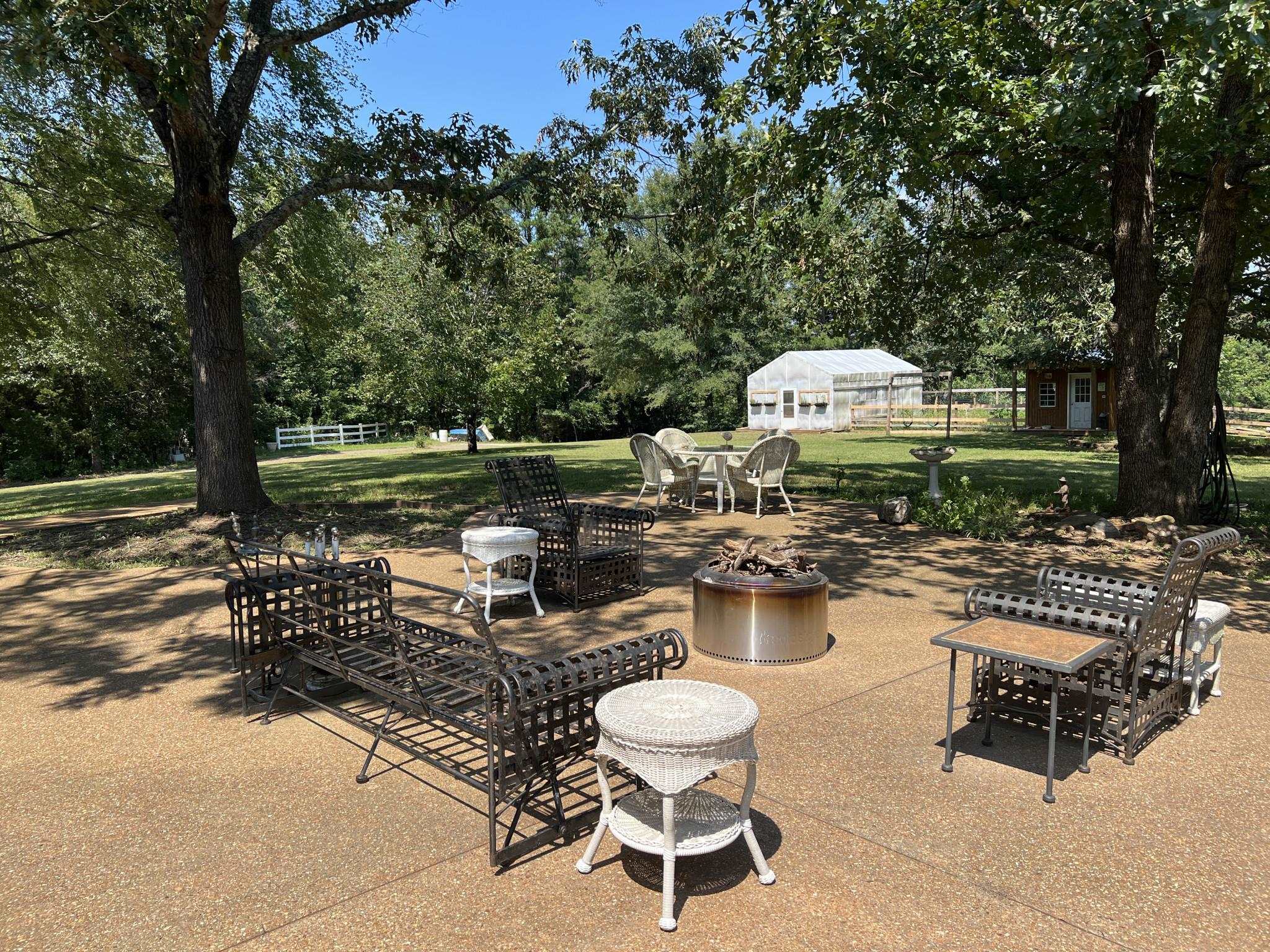 751 Bullman Road Finger, TN 38334 - Photo 14 of 22 a view of a patio with chairs and a table