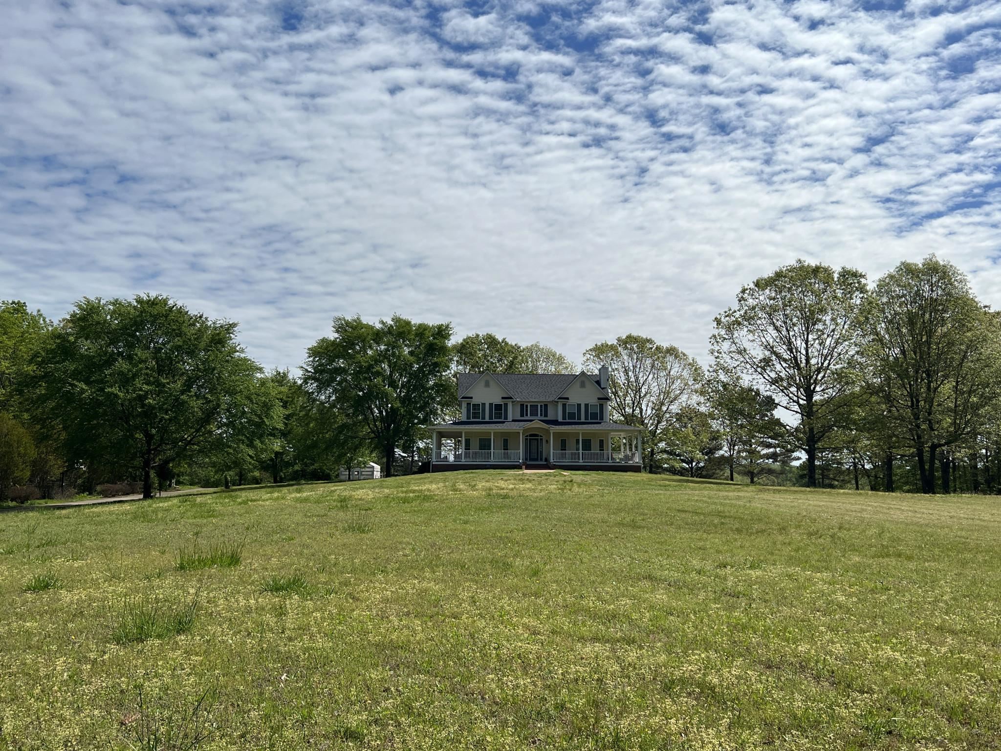751 Bullman Road Finger, TN 38334 - Photo 2 of 22 a view of a green field with trees in the background