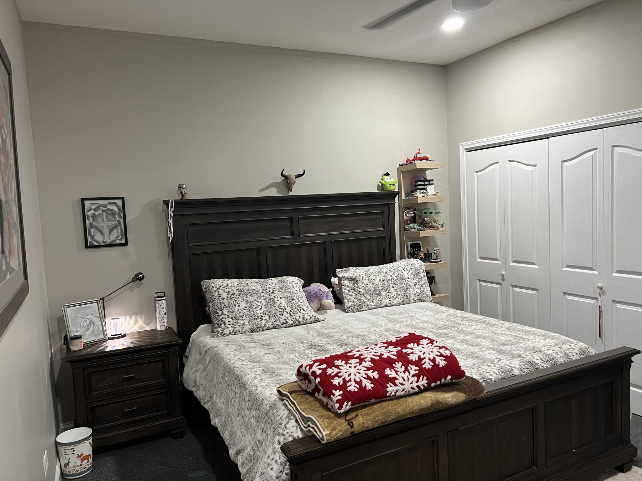 751 Bullman Road Finger, TN 38334 - Photo 8 of 22 a bedroom with a bed and a lamp on dresser