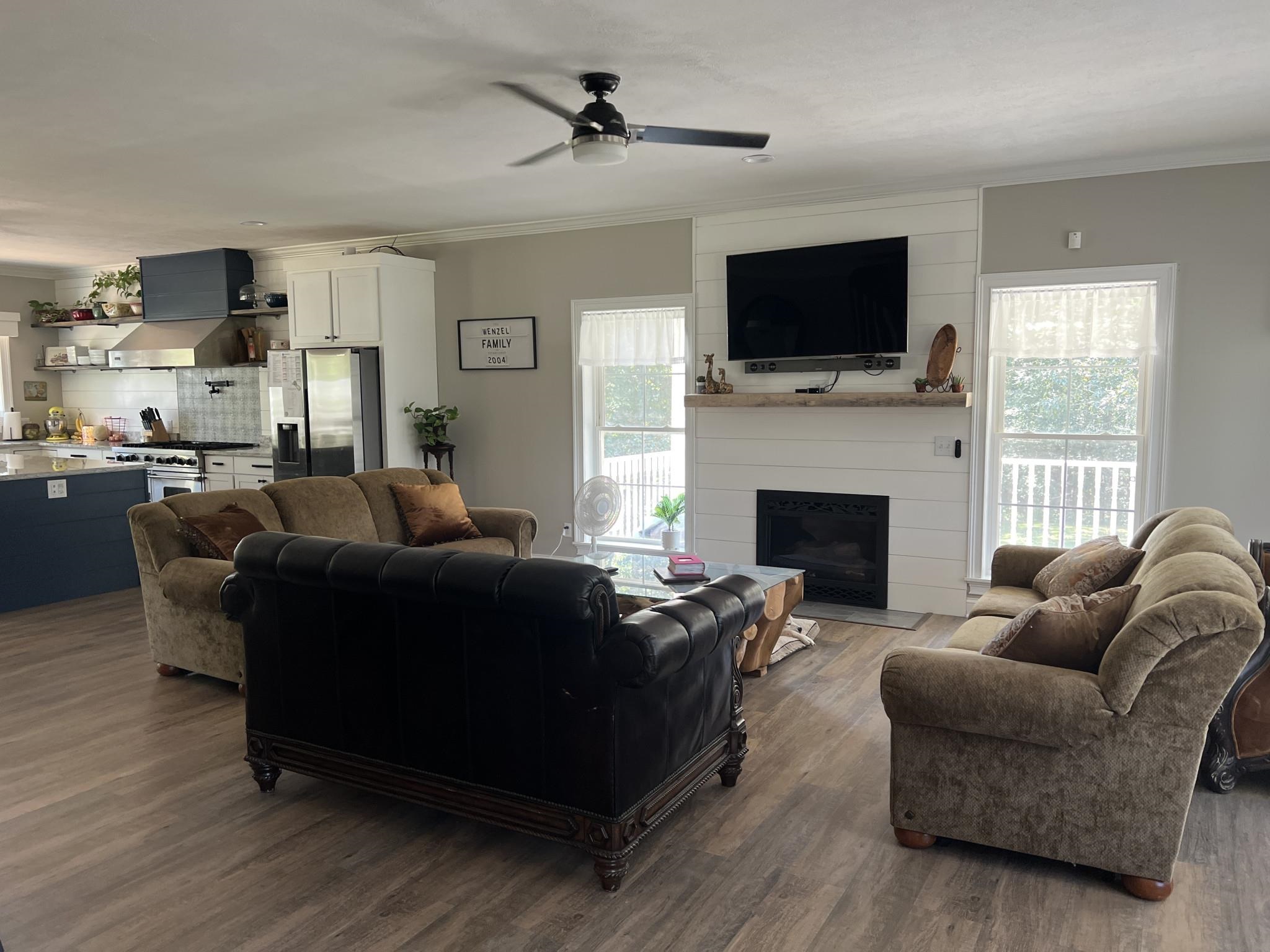 751 Bullman Road Finger, TN 38334 - Photo 9 of 22 a living room with furniture a flat screen tv and a fireplace