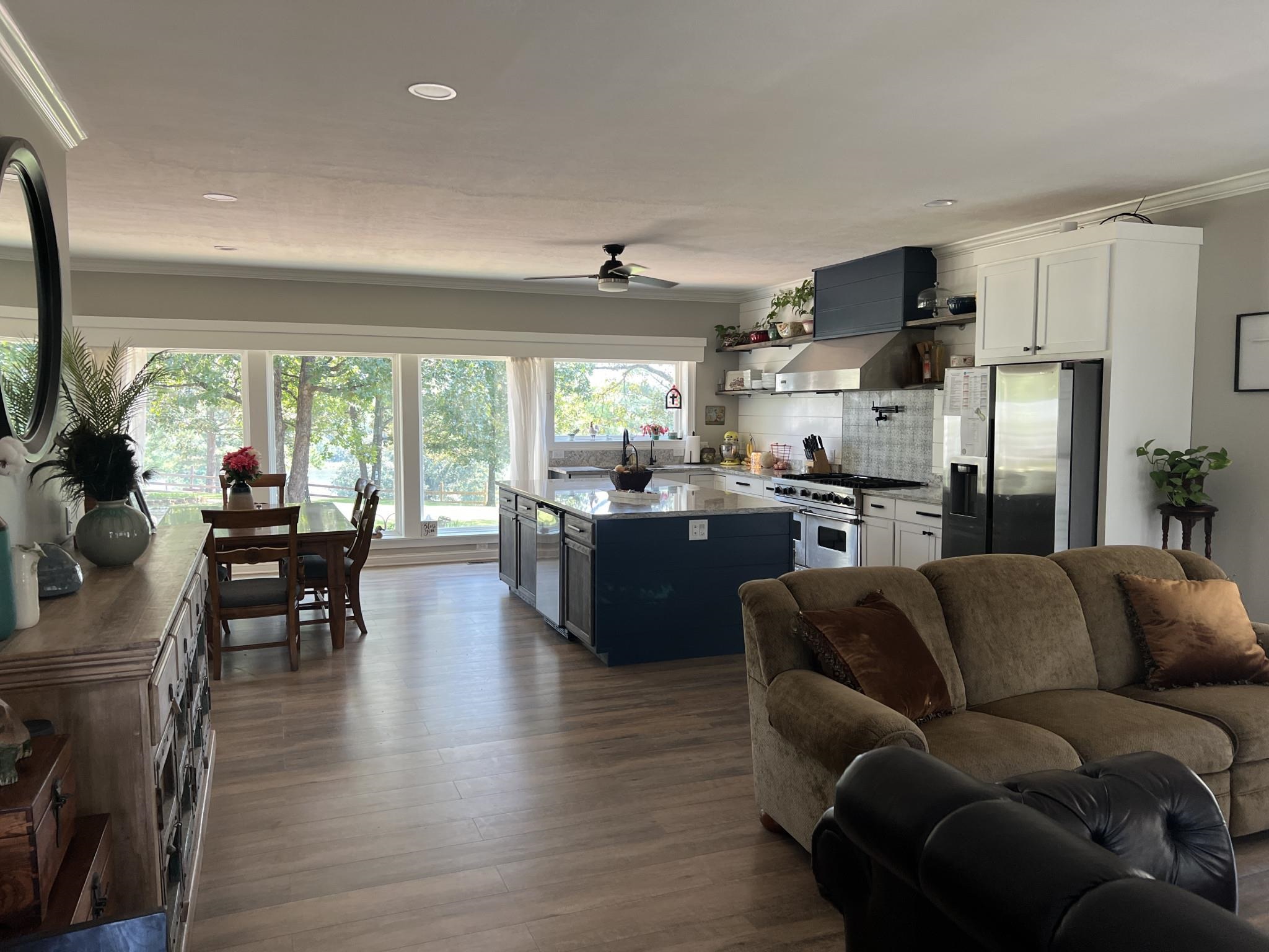 751 Bullman Road Finger, TN 38334 - Photo 10 of 22 a living room with stainless steel appliances kitchen island furniture and a large window