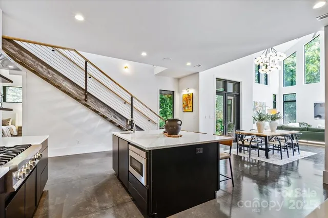 a room with lots of furniture and a large window