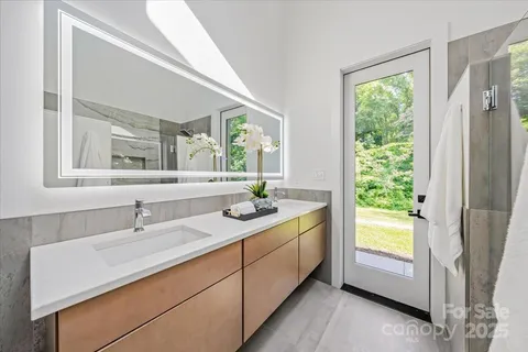 a bathroom with a sink and a window