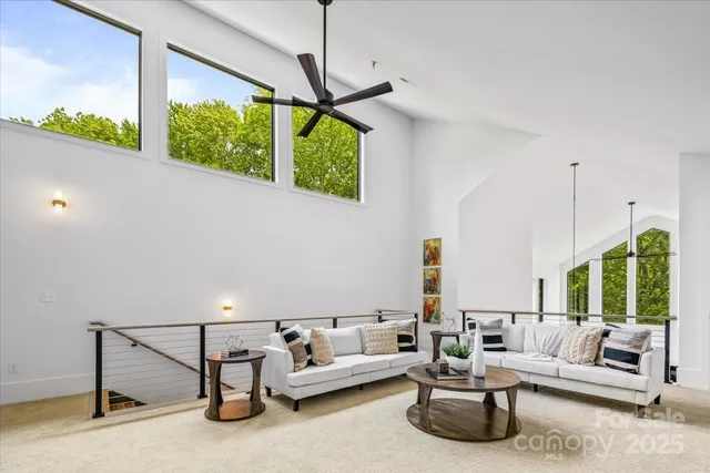 a living room with patio furniture and a window