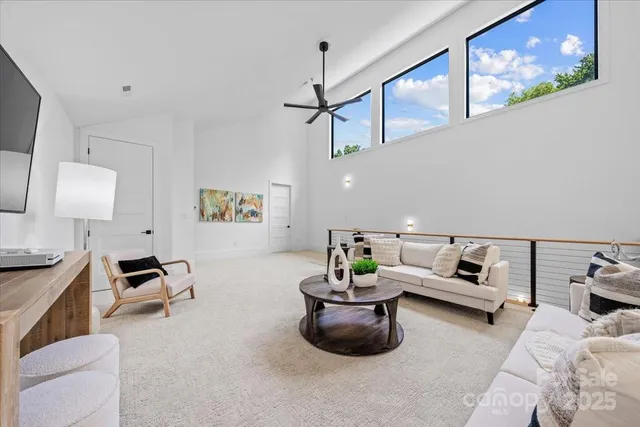 a living room with furniture and a lamp