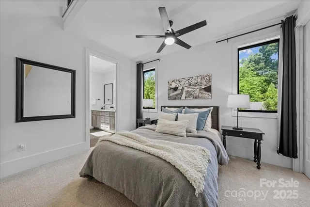 a bedroom with a large bed and a window