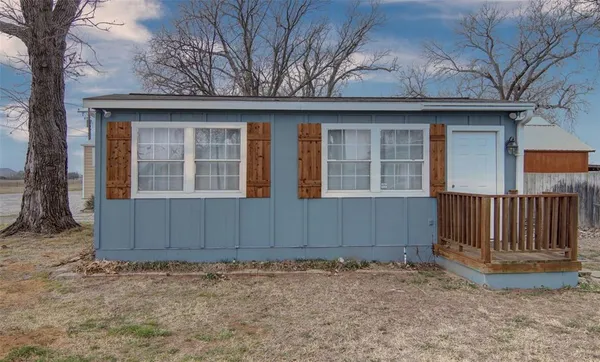 a house with trees in the background