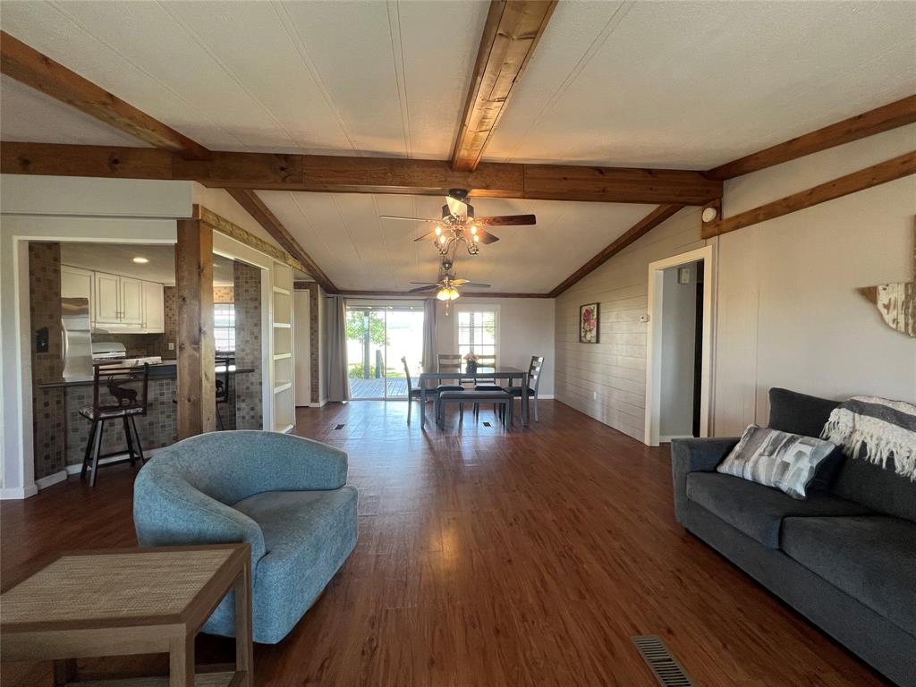 1059 Airport Road Graford, TX 76449 - Photo 3 of 35 a living room with furniture and a wooden floor