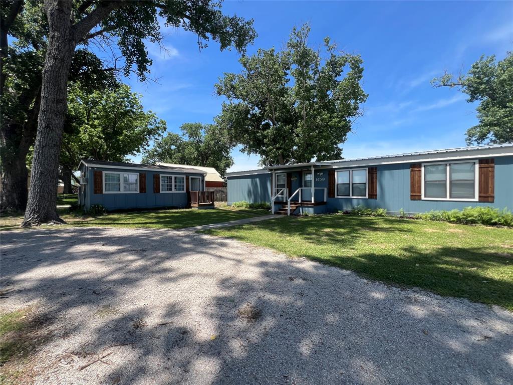1059 Airport Road Graford, TX 76449 - Photo 31 of 35 a view of a house with a yard