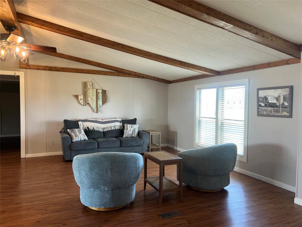 1059 Airport Road Graford, TX 76449 - Photo 4 of 35 a living room with furniture and a window