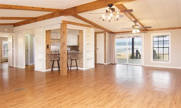 a view of an entryway with wooden floor