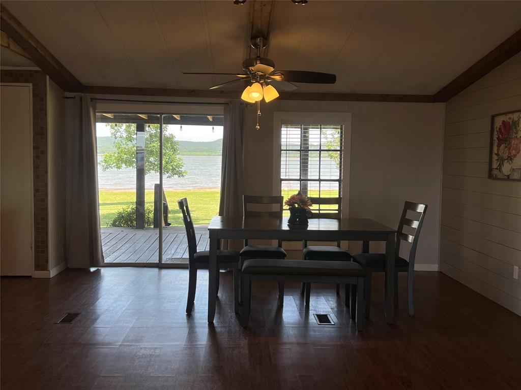 1059 Airport Road Graford, TX 76449 - Photo 7 of 35 a view of a dining room with furniture window and wooden floor
