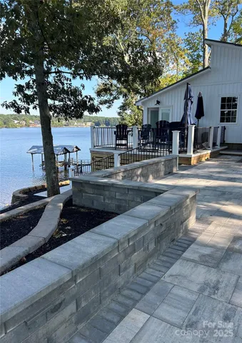 a swimming pool with outdoor seating and yard