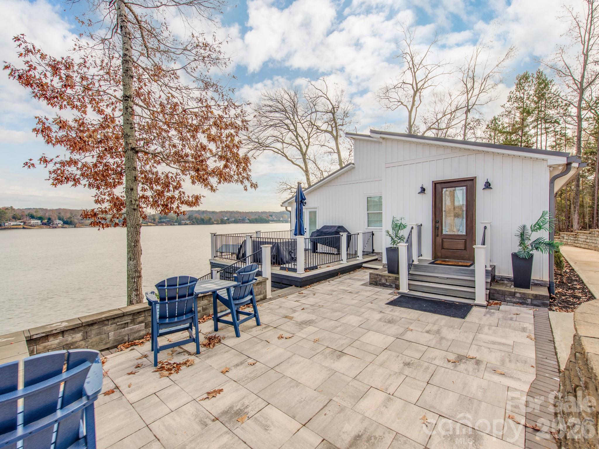 6788 Bucleigh Road Lake Wylie, SC 29710 - Photo 12 of 45 a swimming pool with outdoor seating and yard