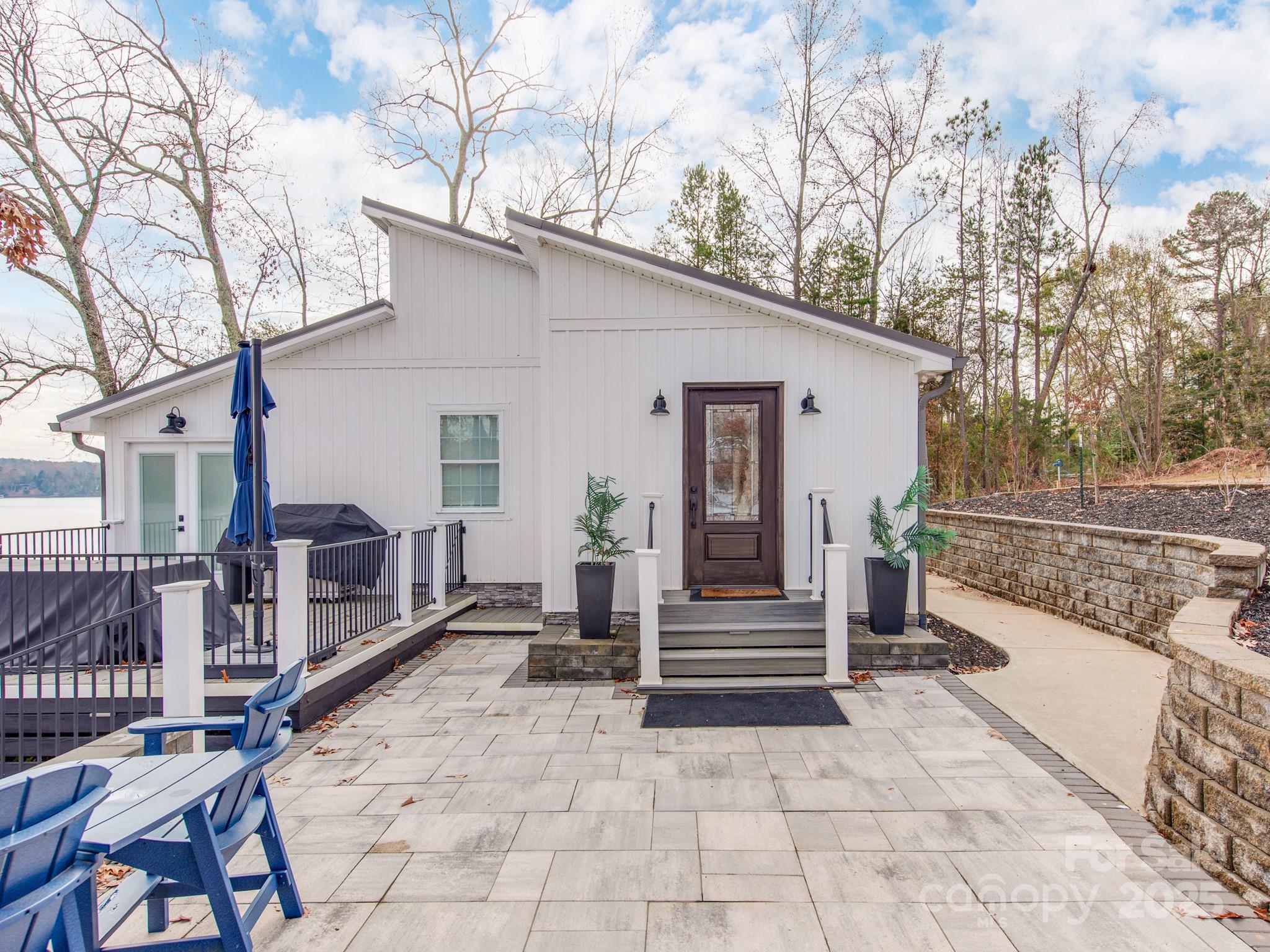 6788 Bucleigh Road Lake Wylie, SC 29710 - Photo 12 of 45 a view of a house with backyard and wooden fence