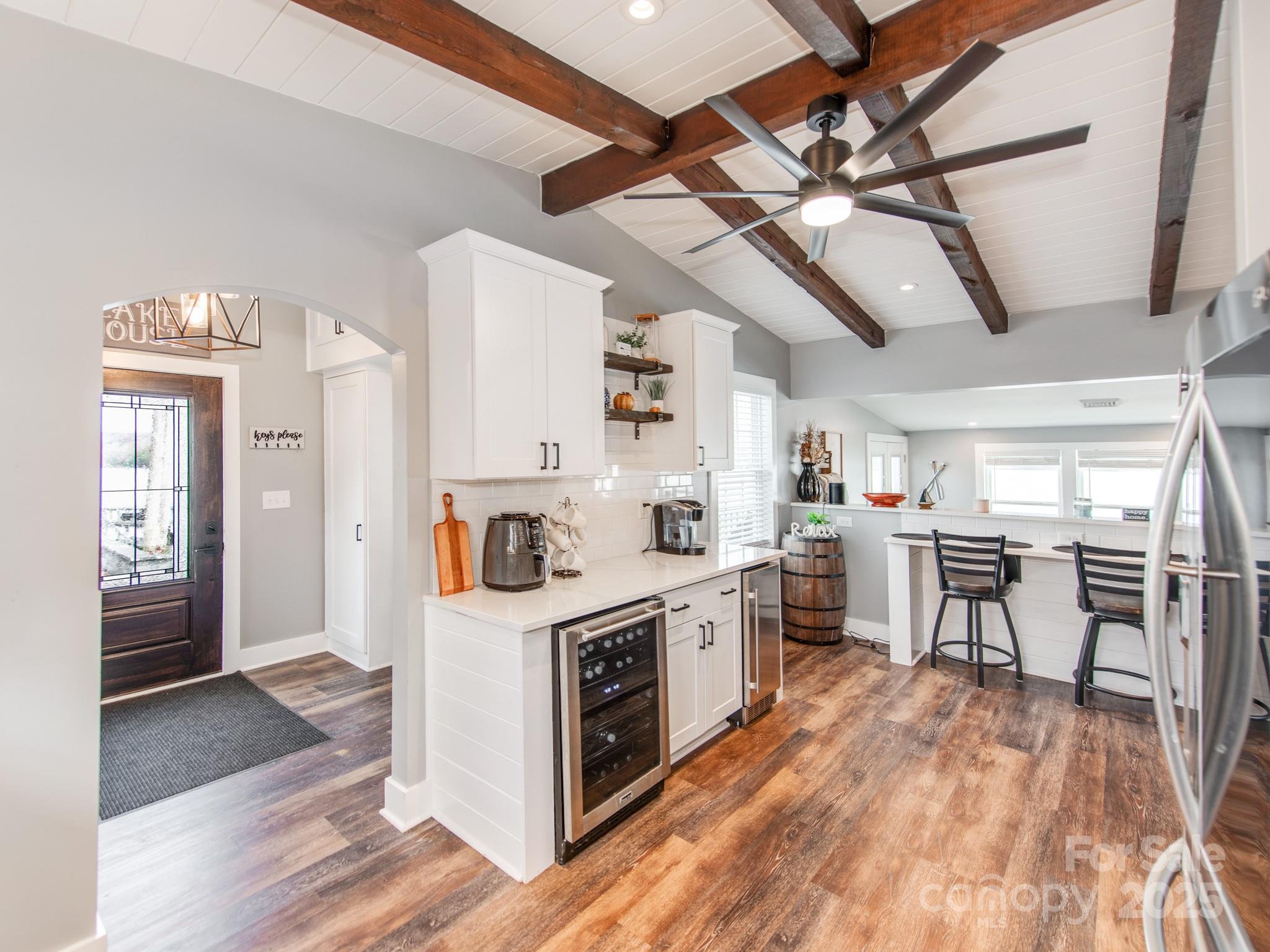 6788 Bucleigh Road Lake Wylie, SC 29710 - Photo 13 of 45 a kitchen that has a lot of cabinets in it and wooden floors