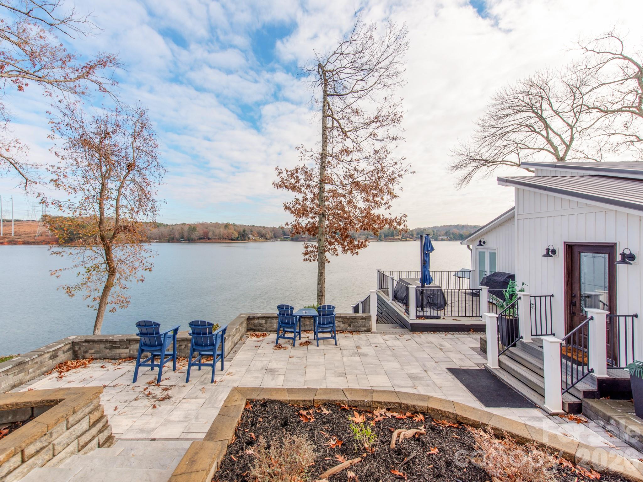 6788 Bucleigh Road Lake Wylie, SC 29710 - Photo 13 of 45 a view of a swimming pool with an outdoor seating