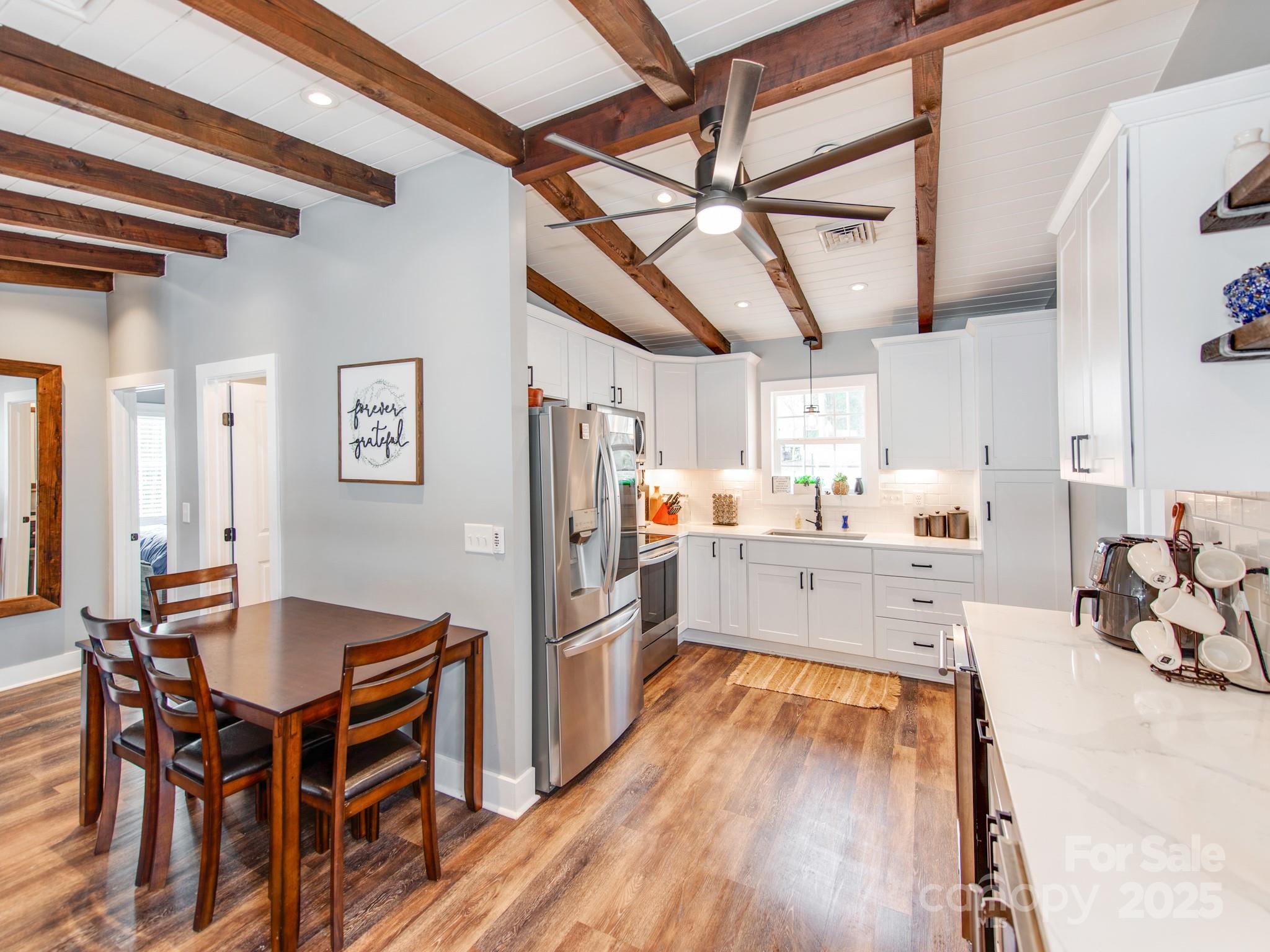 6788 Bucleigh Road Lake Wylie, SC 29710 - Photo 14 of 45 a large kitchen with a table and chairs
