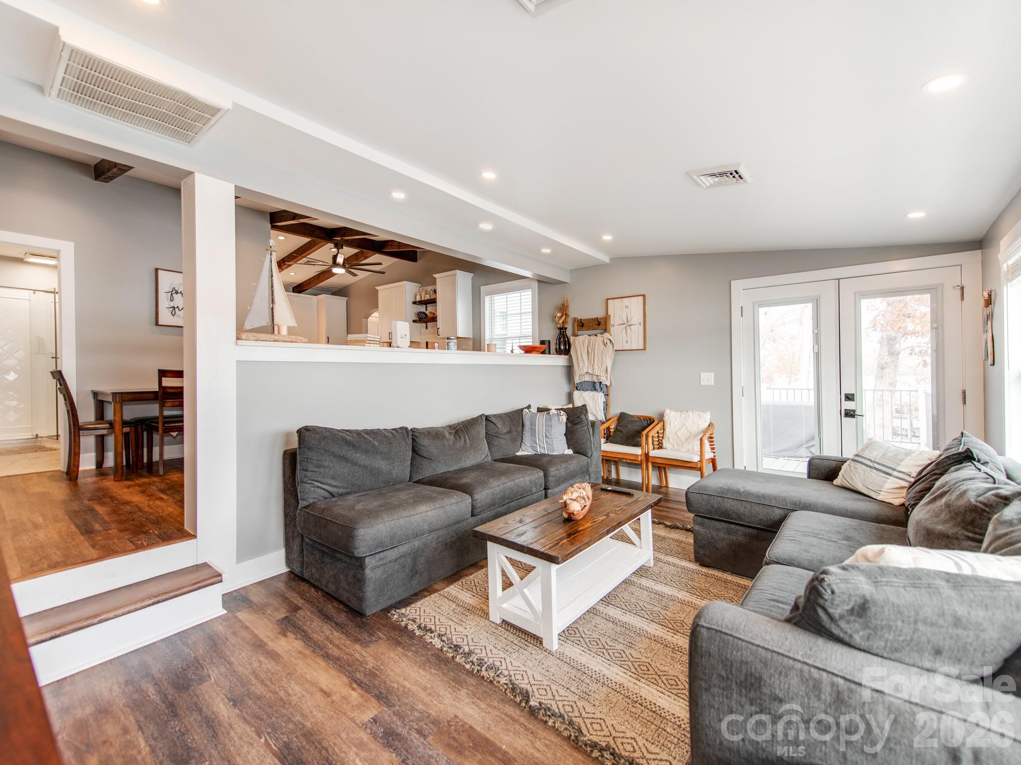 6788 Bucleigh Road Lake Wylie, SC 29710 - Photo 20 of 45 a living room with furniture and a large window