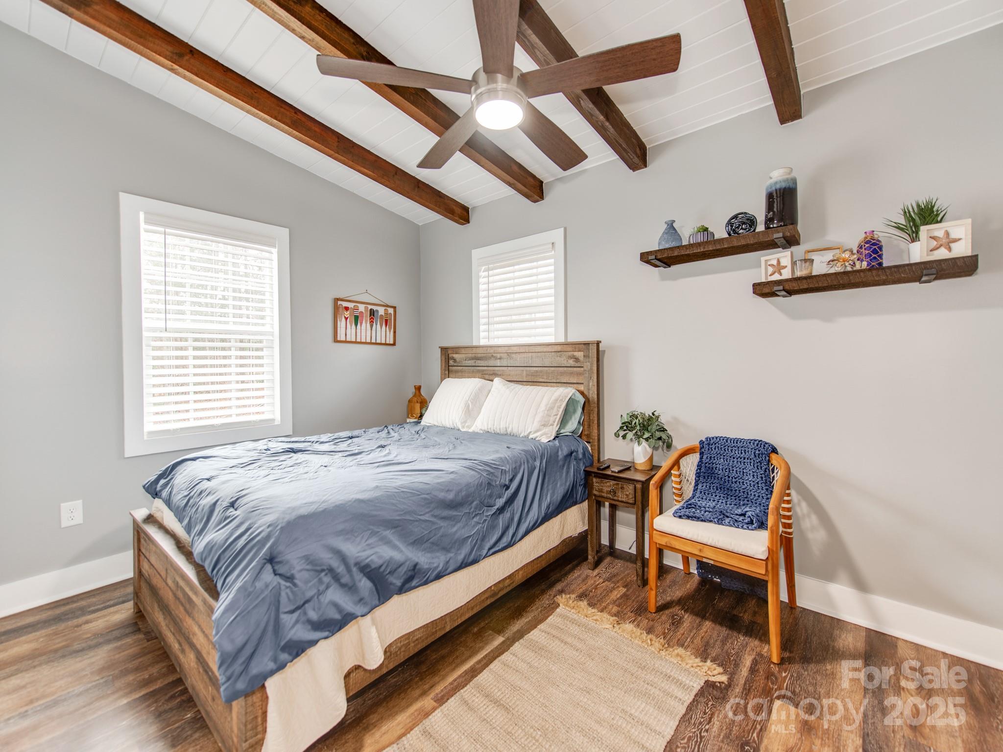 6788 Bucleigh Road Lake Wylie, SC 29710 - Photo 26 of 45 a bed sitting in a bedroom next to a window