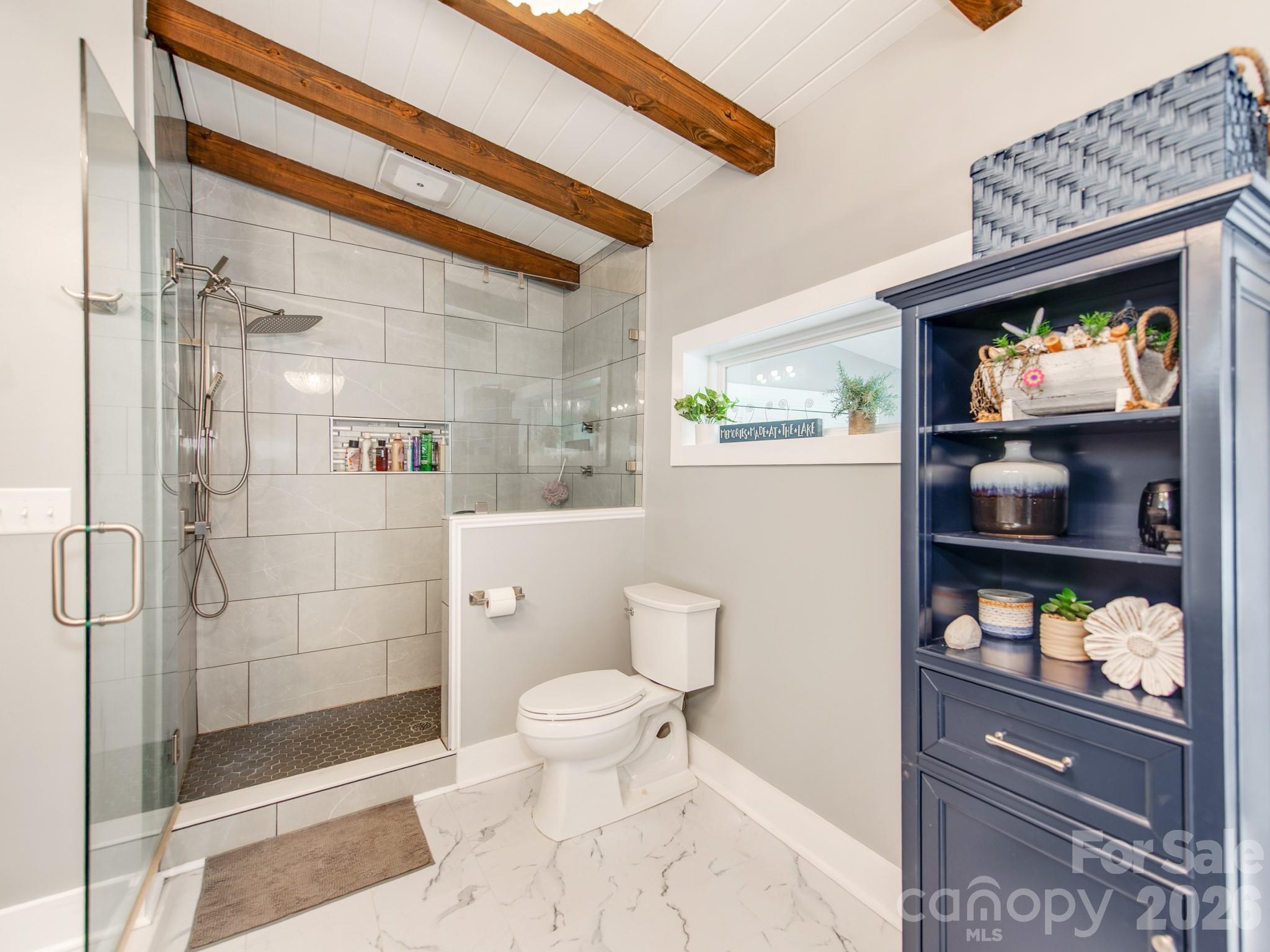 6788 Bucleigh Road Lake Wylie, SC 29710 - Photo 26 of 45 a bathroom with a toilet and a shower