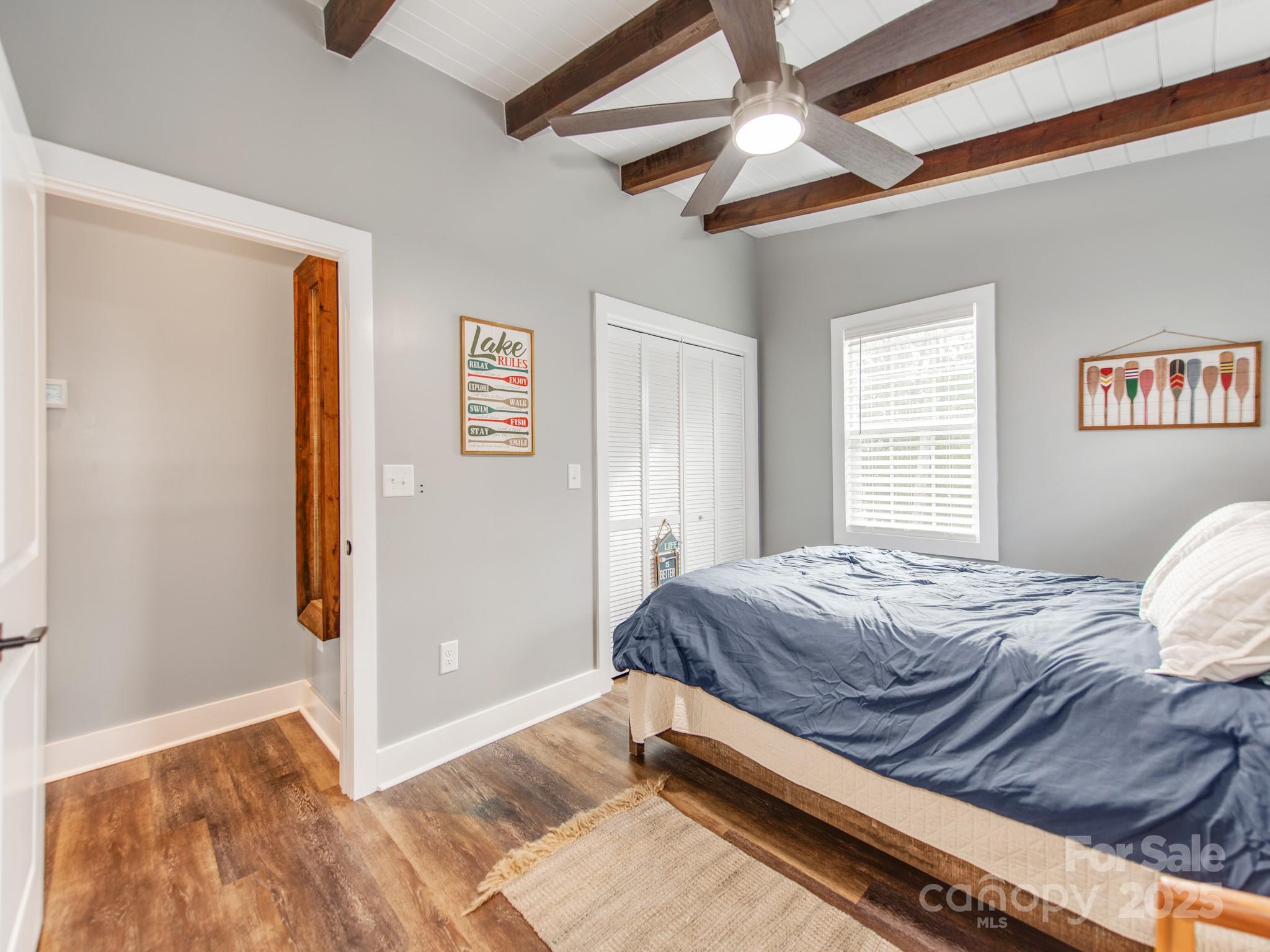 6788 Bucleigh Road Lake Wylie, SC 29710 - Photo 27 of 45 a bed sitting in a bedroom next to a window