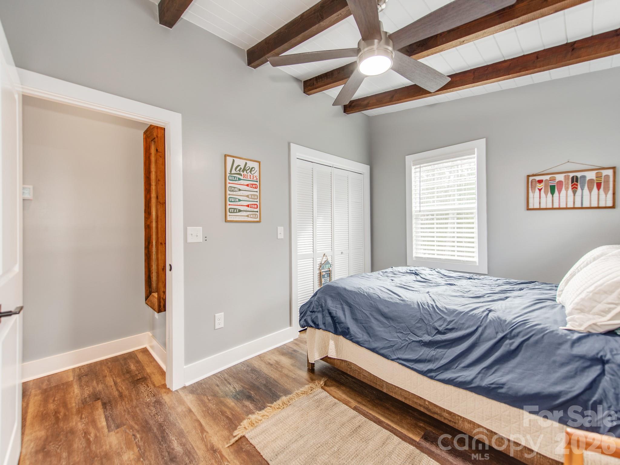 6788 Bucleigh Road Lake Wylie, SC 29710 - Photo 28 of 45 a bed sitting in a bedroom next to a window