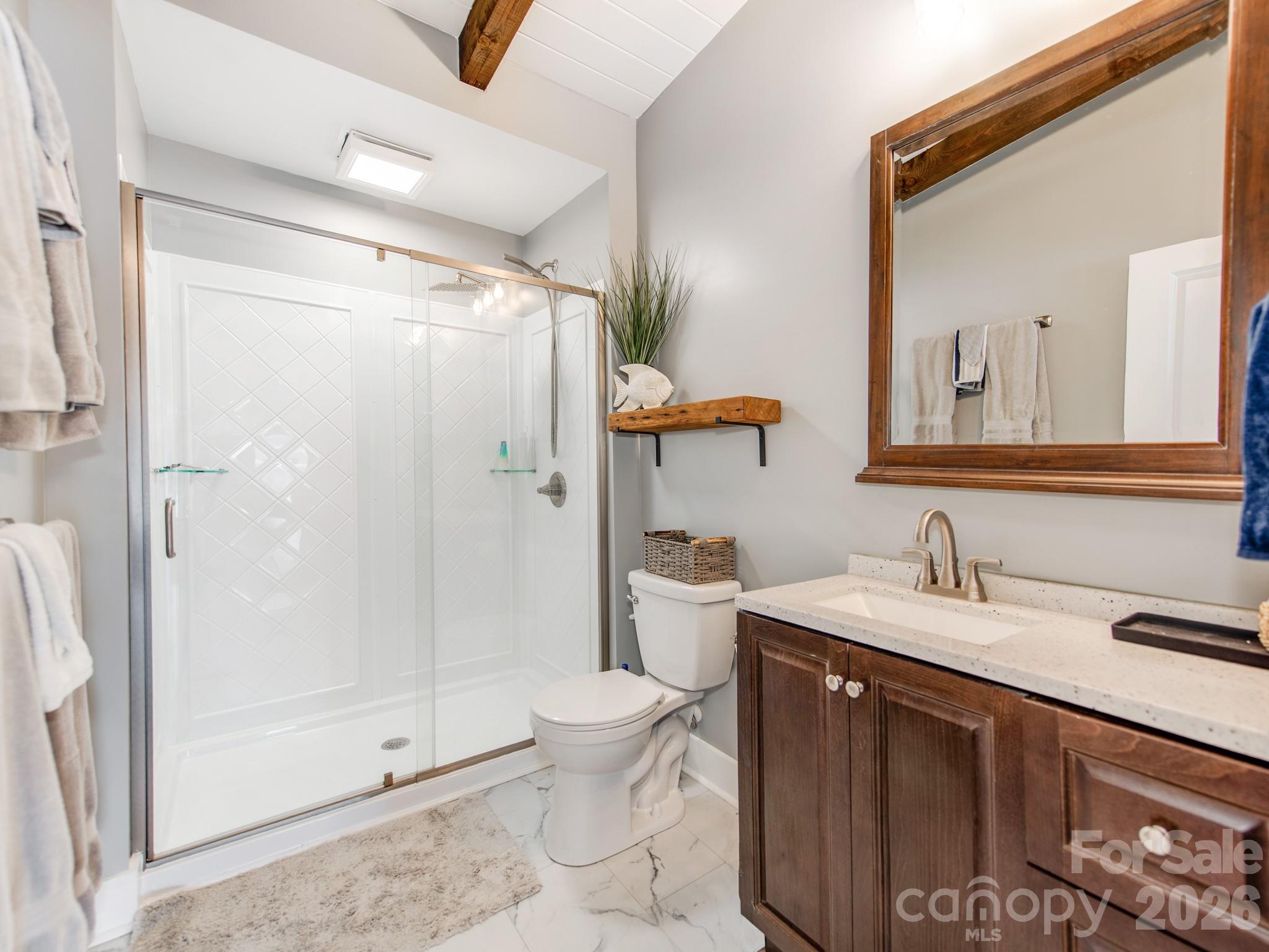 6788 Bucleigh Road Lake Wylie, SC 29710 - Photo 29 of 45 a bathroom with a sink a toilet and shower